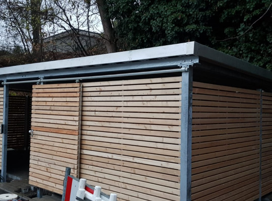 Referenz D-75433 Maulbronn, Mülltonnenhaus, Pultdach, Trapezblech, Holz von Welcomp